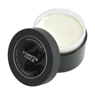Pote preto aberto de sabonete de barbear PORTUS CALE com tampa com texto preto