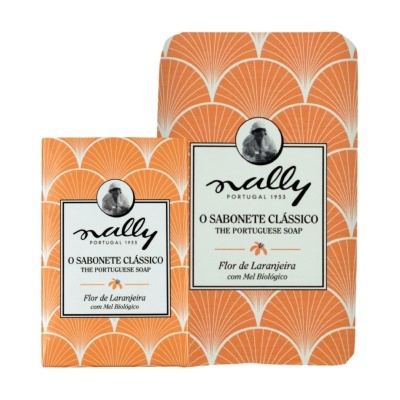 Caixas de sabonete Nally Flor de Laranjeira embaladas em papel laranja com padrão branco