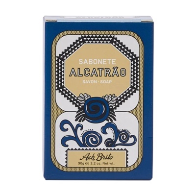 Embalagem de sabonete azul e bege com texto e design decorativo