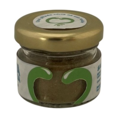 frasco pequeno de vidro com tampa dourada e rótulo branco com detalhes verdes