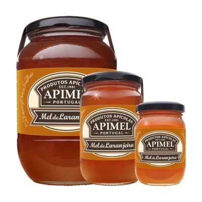 Três frascos de mel de laranjeira Apimel Portugal com rótulos castanhos e creme