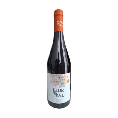 Garrafa de vinho tinto Flor de Sal com rótulo branco e tampa laranja