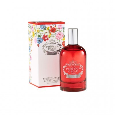 Frasco de perfume vermelho com tampa prateada e embalagem floral