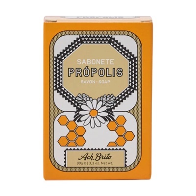 Embalagem de sabonete Própolis Ach.Brito com design em laranja, preto e branco