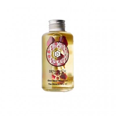 Frasco transparente de óleo seco milagroso Benamôr com pétalas dentro