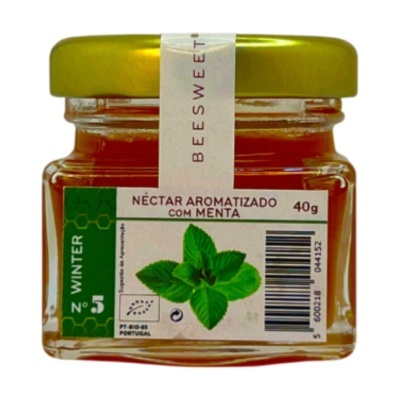 Frasco de vidro com néctar aromatizado com menta e tampa dourada