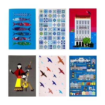 Seis cadernos ilustrados com temas variados de peixes, azulejos, edifícios, fado, pássaros e construções.