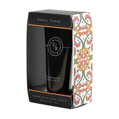 Creme de mãos perfumado Santal Tonka Castelbel em embalagem preta com padrões florais coloridos