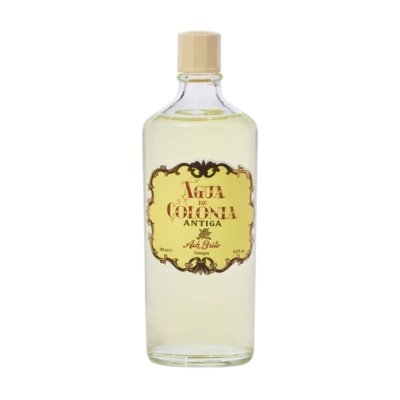 Gar flask containing yellow liquid with decorative label