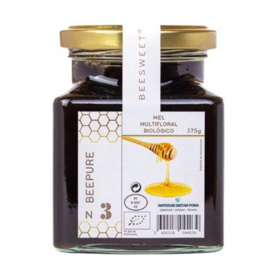 Frasco de mel multifloral biológico BEESWEET com rótulo branco e tampa dourada
