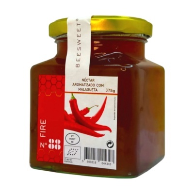 Frasco de néctar aromatizado com malagueta com tampa dourada e rótulo branco e vermelho