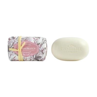 Sabonete branco oval e embalagem floral com etiqueta rosa de sabonete Jasmim Branco Castbel Porto