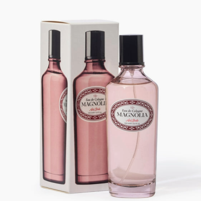 Frasco de colónia Magnolia rosa com tampa preta e caixa branca com imagem do frasco.