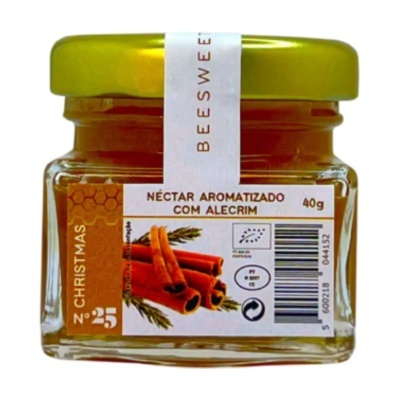 Frasco de néctar aromatizado com alecrim com tampa dourada em fundo branco