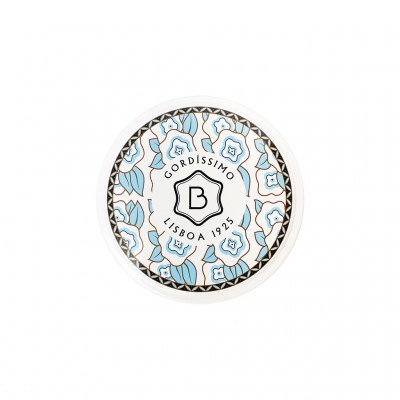 Frasco redondo branco com tampa floral azul e bege e texto GORDISSIMO LISBOA 1925