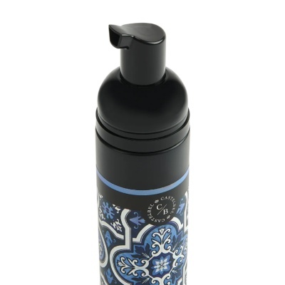 Frasco dispensador preto com padrão decorativo azul e branco