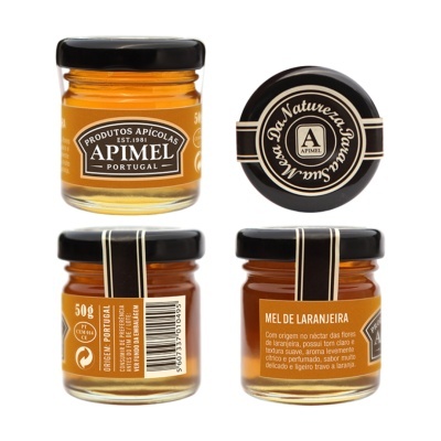 Frascos de mel de laranjeira APIMEL Portugal de 50g com rótulos laranja e tampas pretas