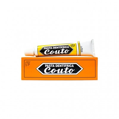 pasta dentífrica Couto em tubo branco e amarelo sobre caixa laranja