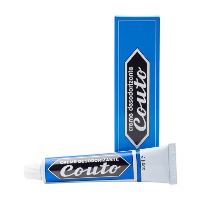Creme desodorizante Couto em tubo azul e branco com caixa azul ao fundo