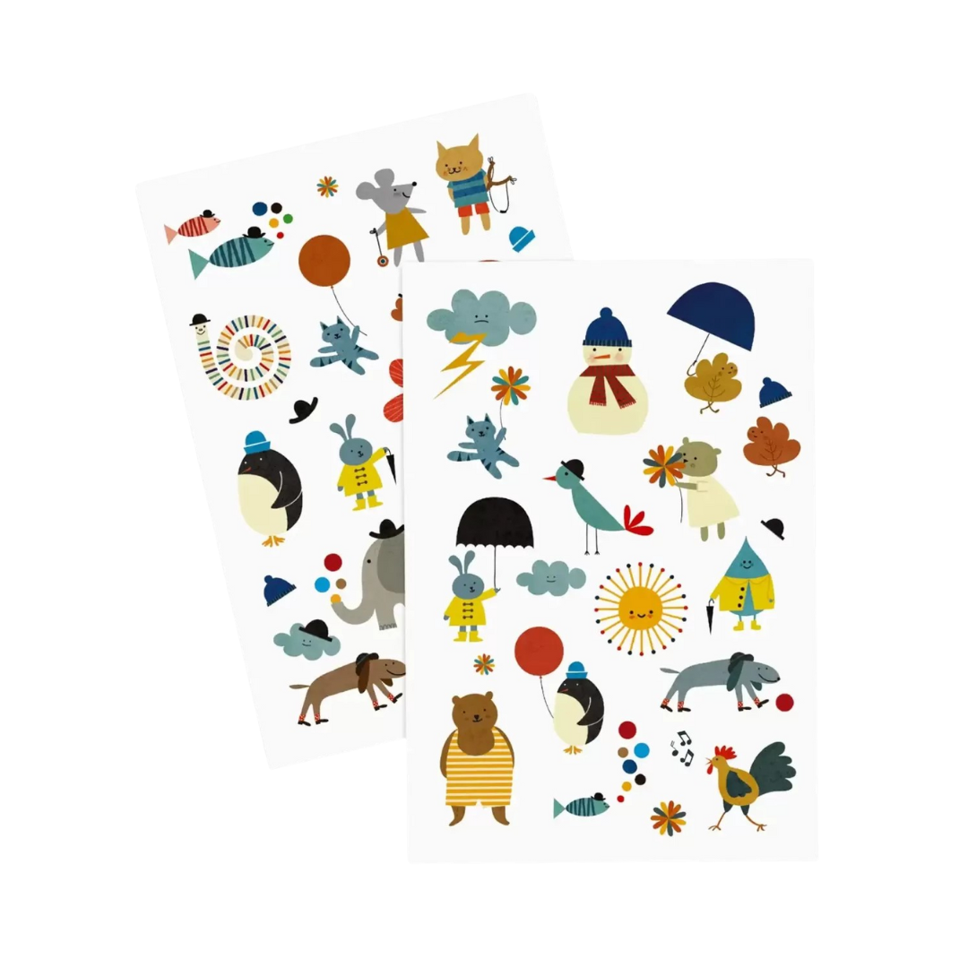 Folhas com autocolantes de animais e objetos coloridos em formato caricatural