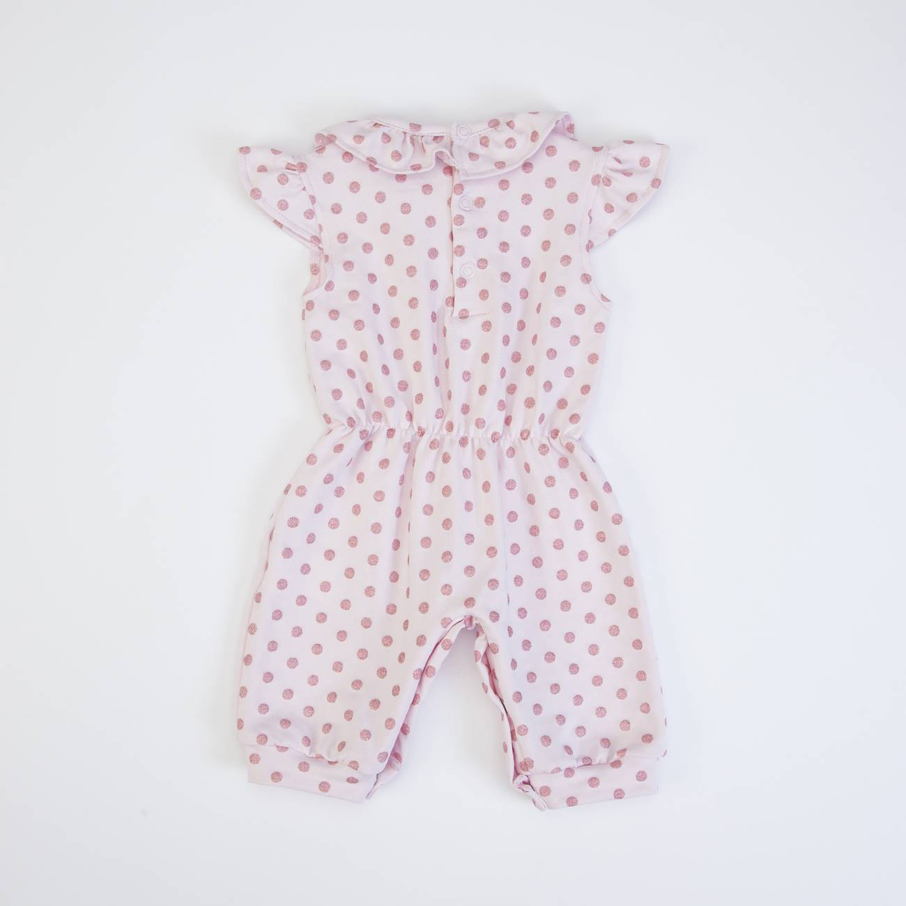 Macacão de bebé branco com bolinhas rosa e gola com folhos