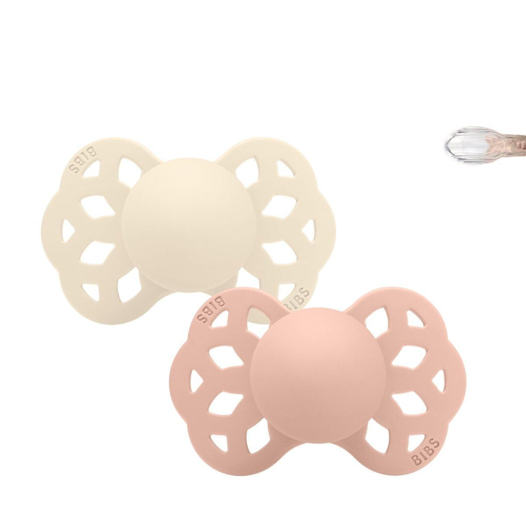 Duas chuchas BIBS cores creme e rosa claro com design em asa de borboleta