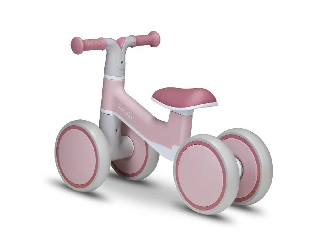 Triciclo infantil rosa e branco com quatro rodas e assento almofadado