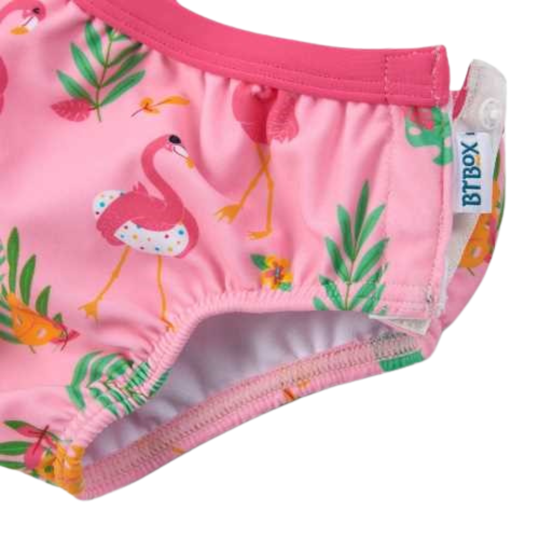Cueca de banho rosa com padrões coloridos e etiqueta BITBOX