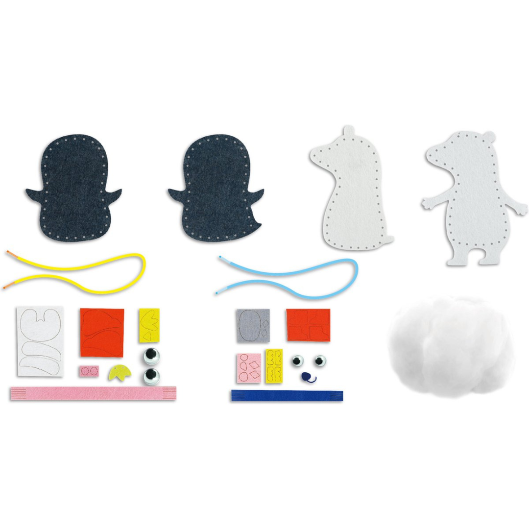 Peças de feltro, fios coloridos, olhos plásticos e enchimento para montar bonecos