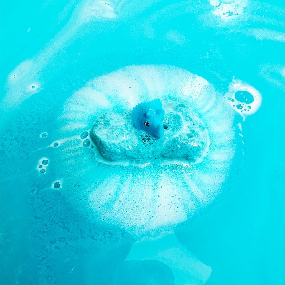 Bomba de banho azul efervescente com figura de dinossauro