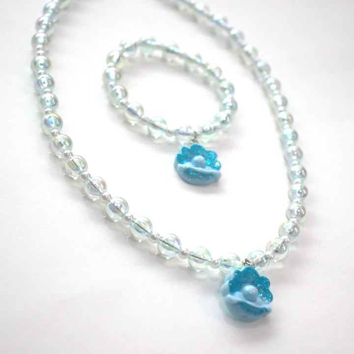 Colar e pulseira com contas transparentes e pingentes azuis em forma de flor