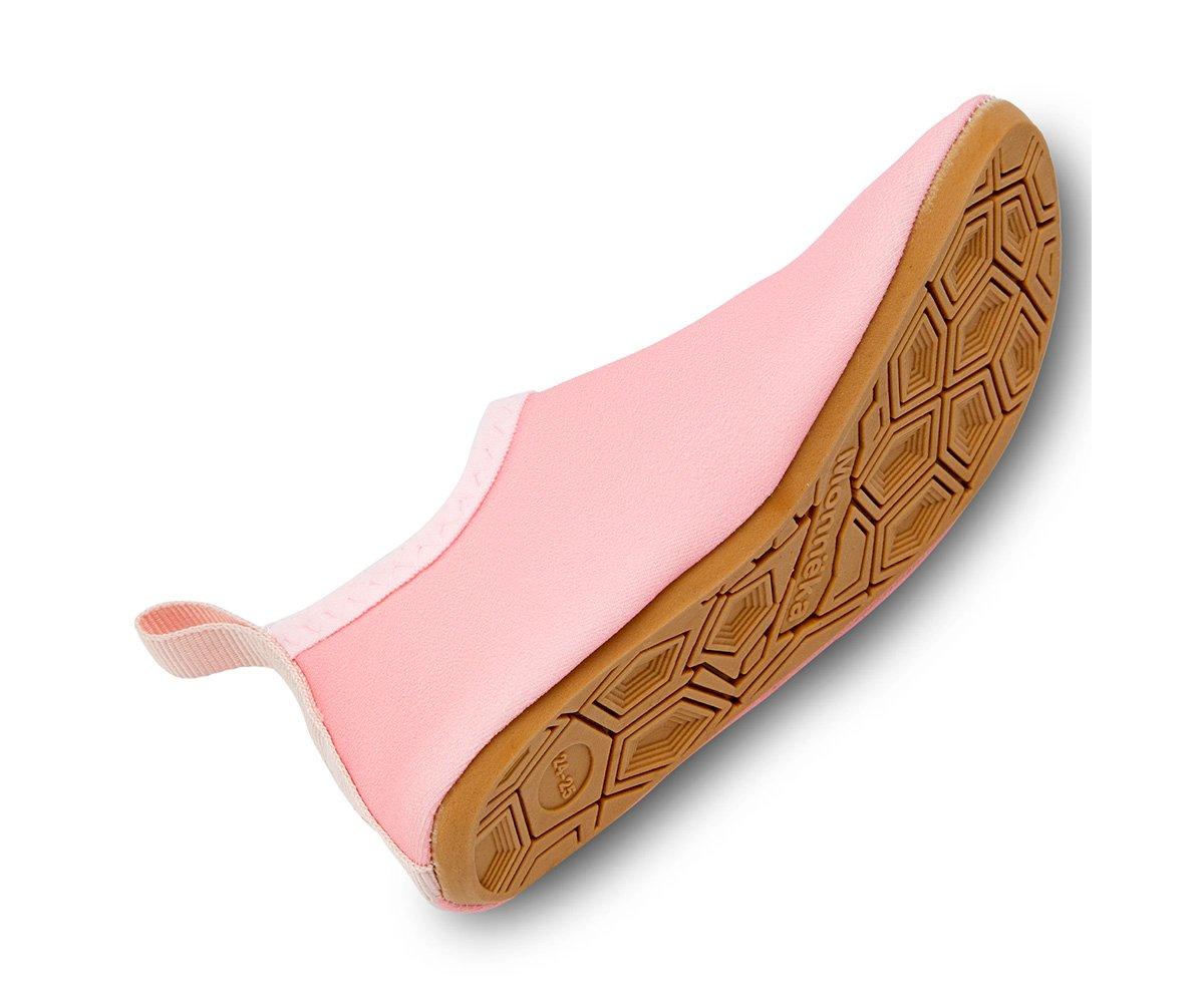 Tênis de criança cor-de-rosa com sola castanha