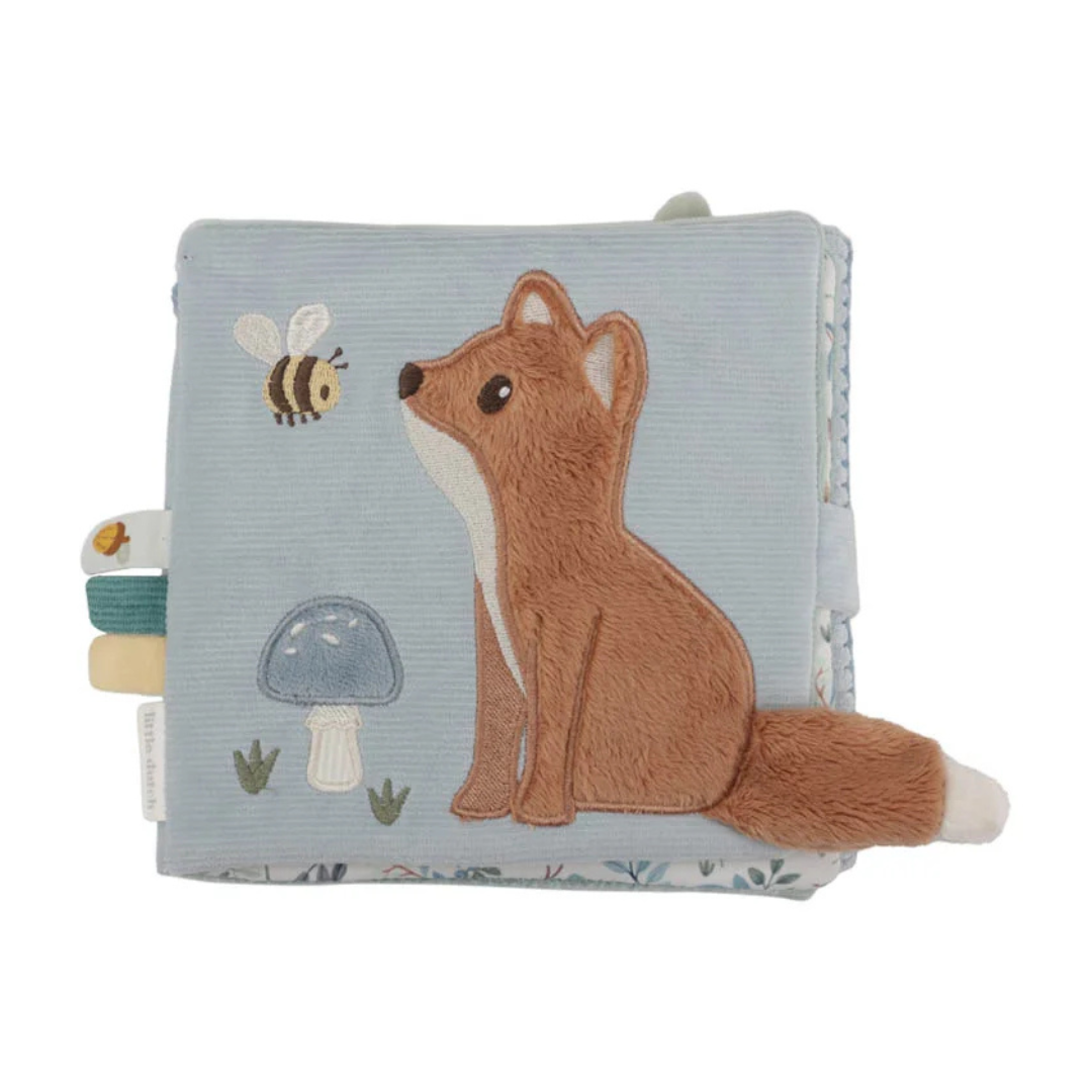 Livro de tecido azul claro com raposa castanha e abelha