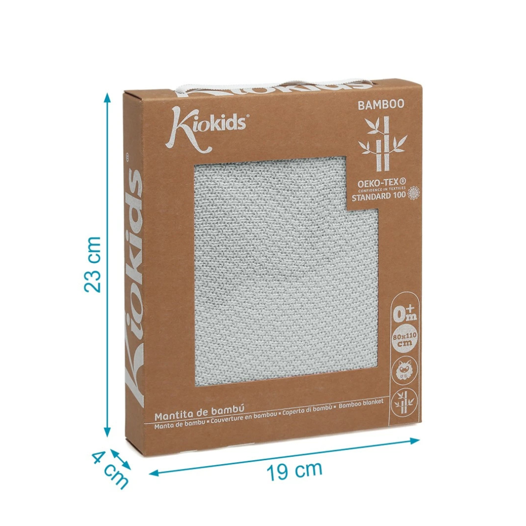 Caixa de manta de bambu Kiokids com janela transparente mostrando a manta cinzenta e textos na embalagem