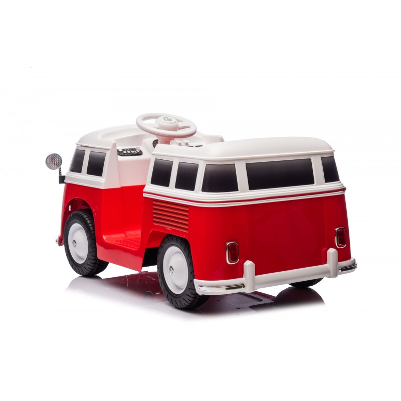 Carrinho de brinquedo vermelho e branco em forma de carrinha clássica com rodas e volante