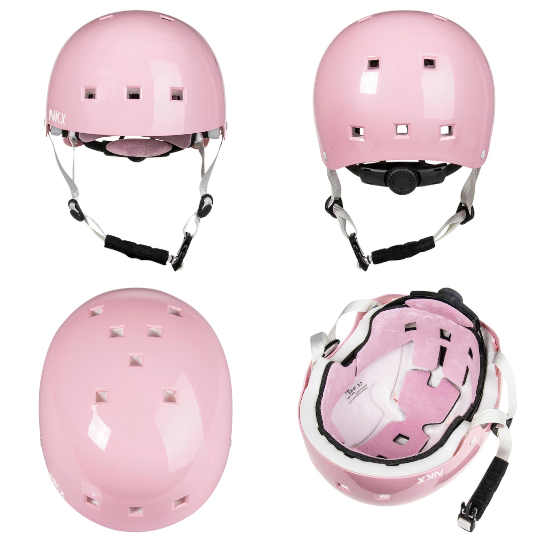 Capacete rosa com ventilação quadrada, acolchoado interior e correias ajustáveis.
