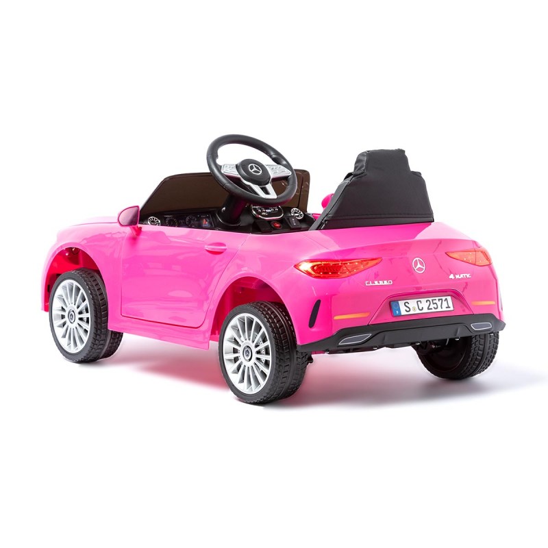 Carro elétrico infantil cor de rosa com volante e luzes traseiras