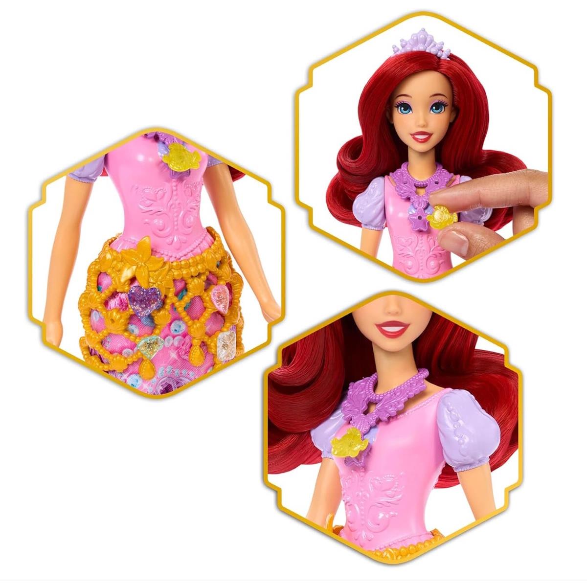 Boneca com vestido rosa e lilás e acessórios decorativos coloridos