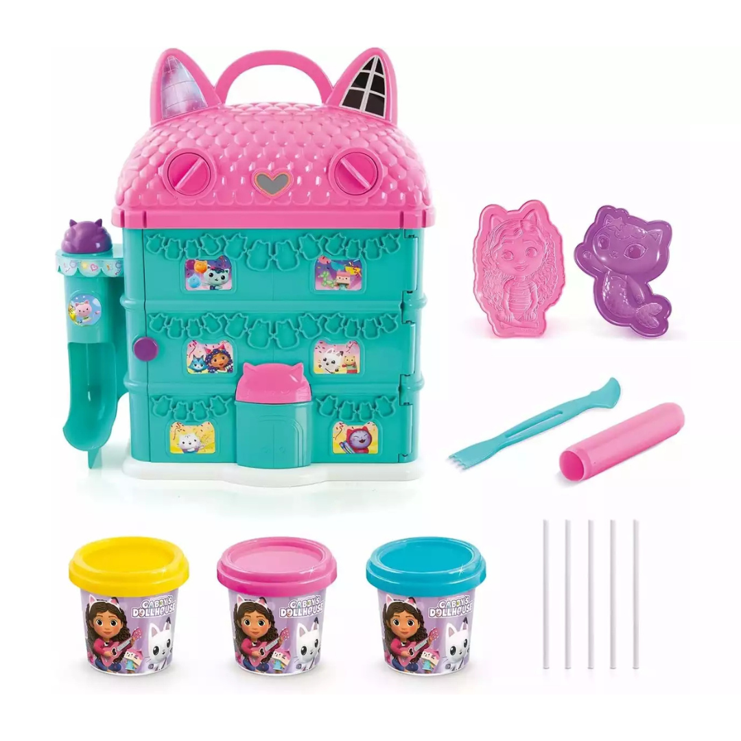 Conjunto de brinquedo com casa de plástico rosa e verde, potes de massa colorida e acessórios de modelagem.