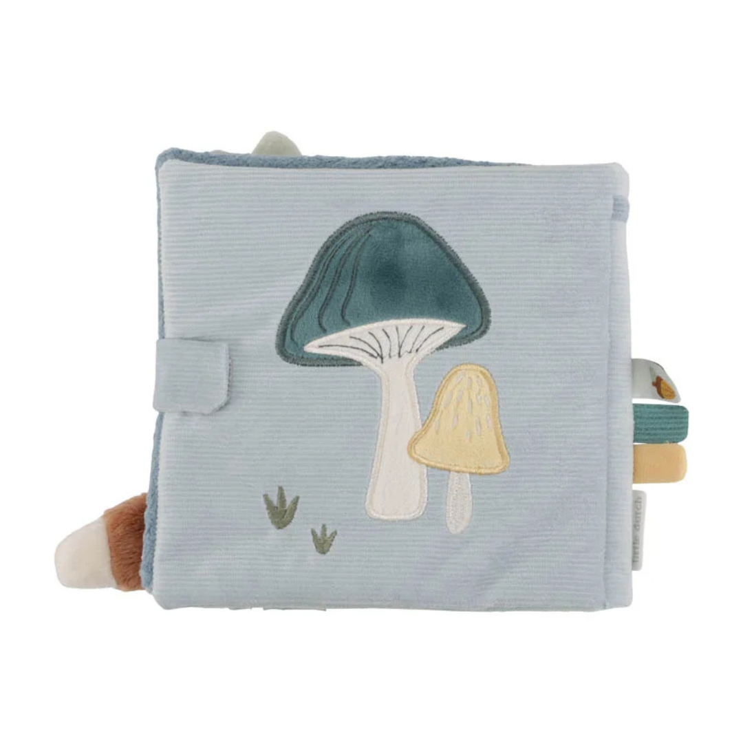 Livro de tecido azul com bordados de cogumelos e abas laterais coloridas