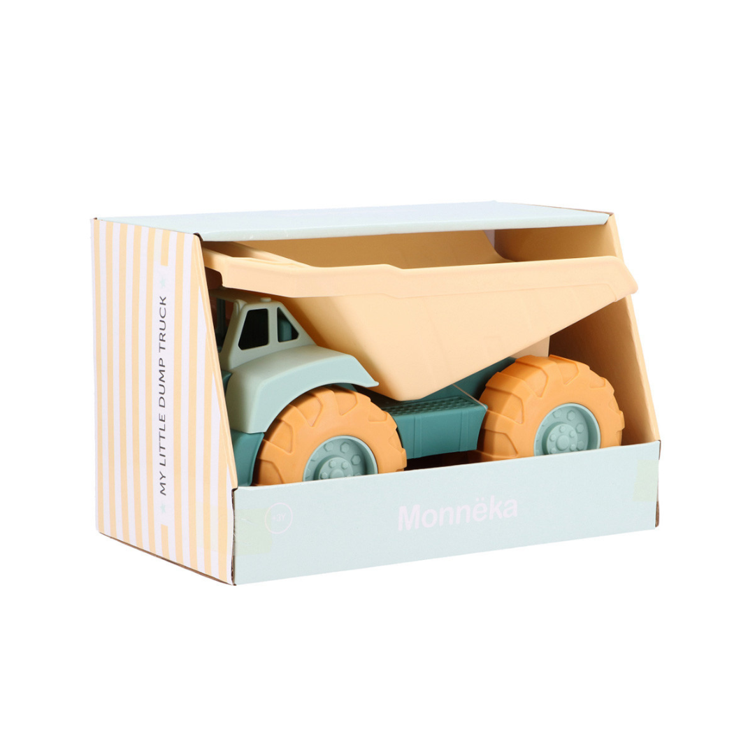 Camião de brinquedo azul claro e laranja em embalagem listrada