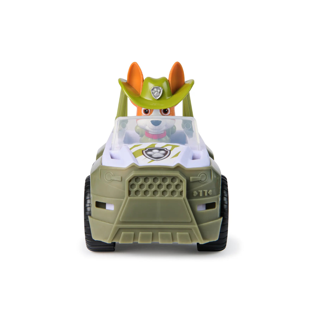 Carrinho de brinquedo verde e branco com personagem canino dentro