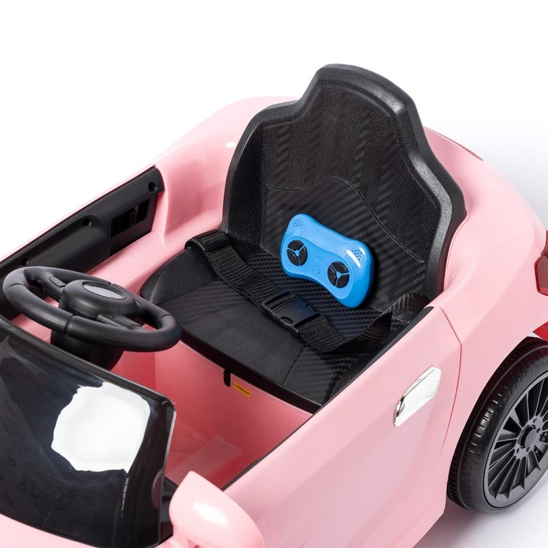 Carro de brinquedo cor-de-rosa com volante e banco preto e comando azul no banco