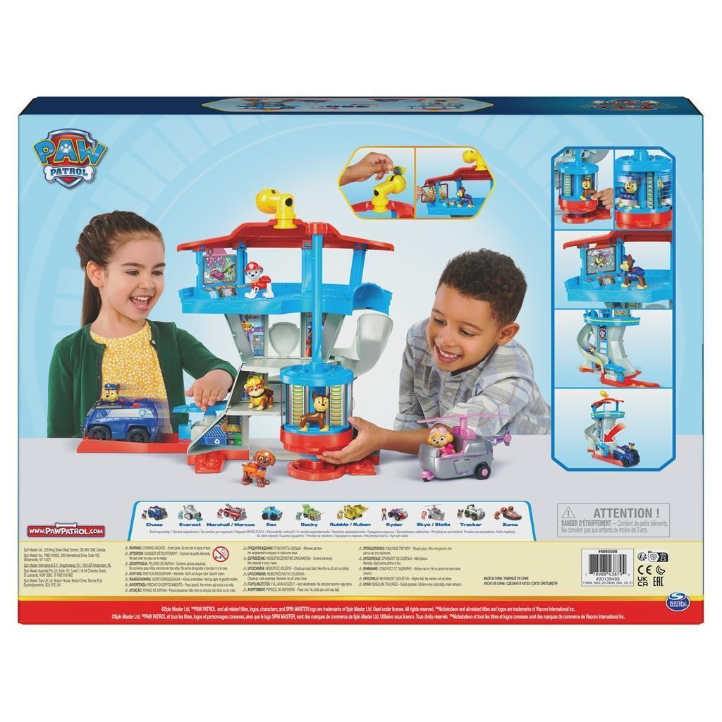 Brinquedo PAW Patrol torre de controlo com figuras e veículos, crianças a brincar.