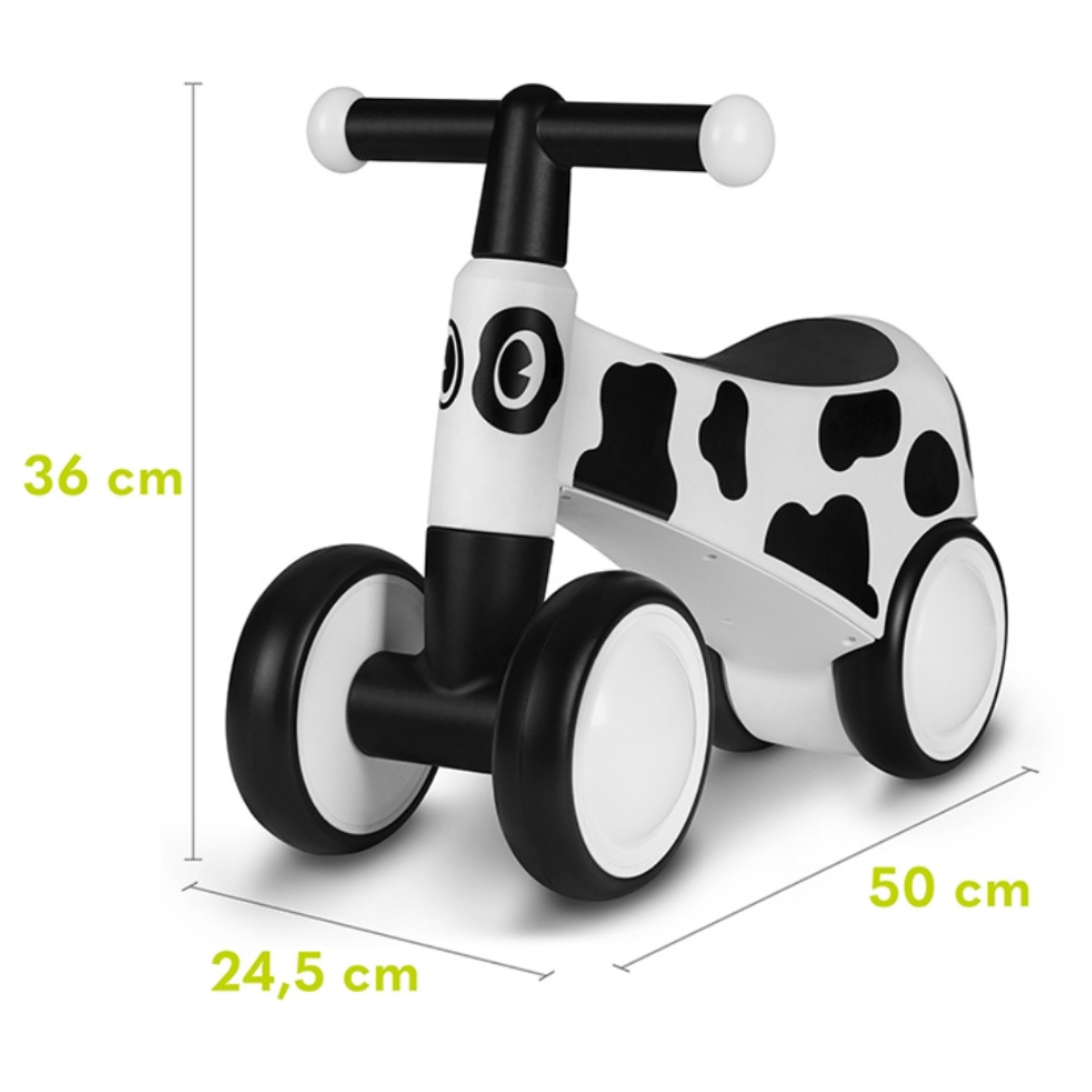 Triciclo infantil preto e branco com padrão de vaca e dimensões indicadas