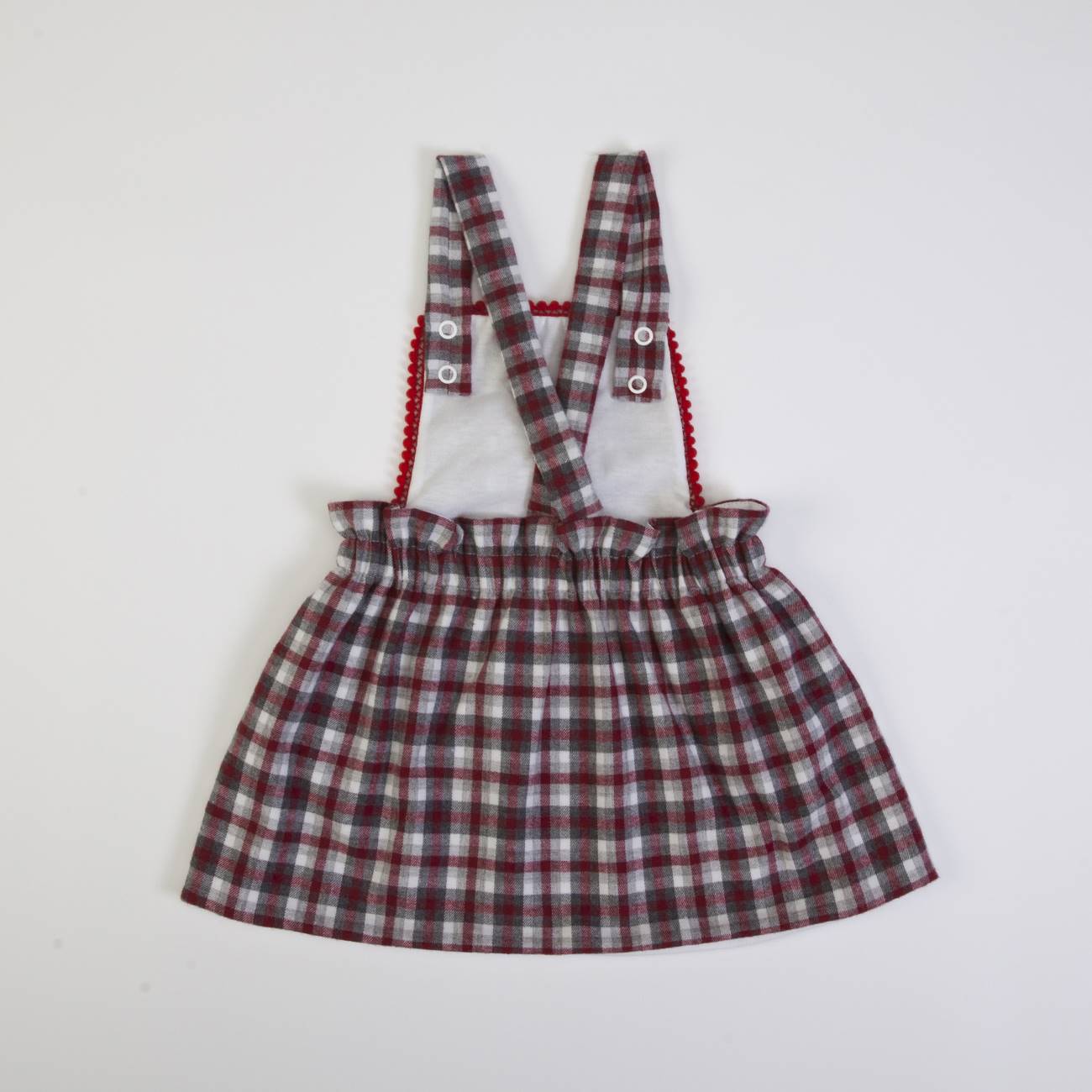 Saia de bebé às riscas com alças cruzadas e detalhe em renda vermelha