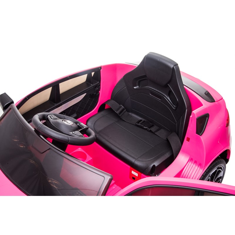 Carro de brinquedo rosa com banco e volante preto