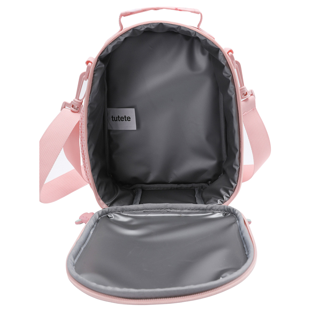 Mala térmica cor-de-rosa aberta com interior cinzento e etiqueta tutete.