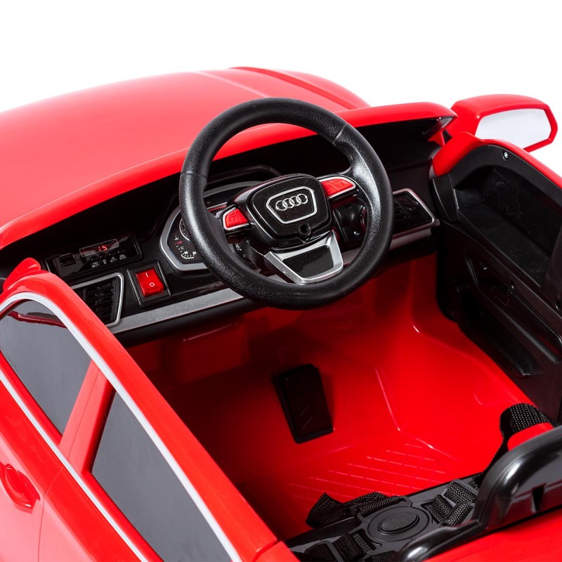 Carro elétrico infantil Audi vermelho com volante preto e interior detalhado