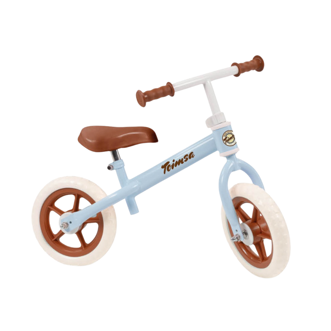 Bicicleta de treino azul claro para criança com pneus brancos e detalhes castanhos